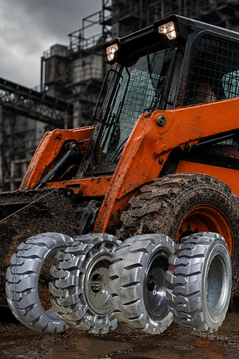 Oranje schranklader met vier CargoMaster Bobcat banden op de voorgrond
